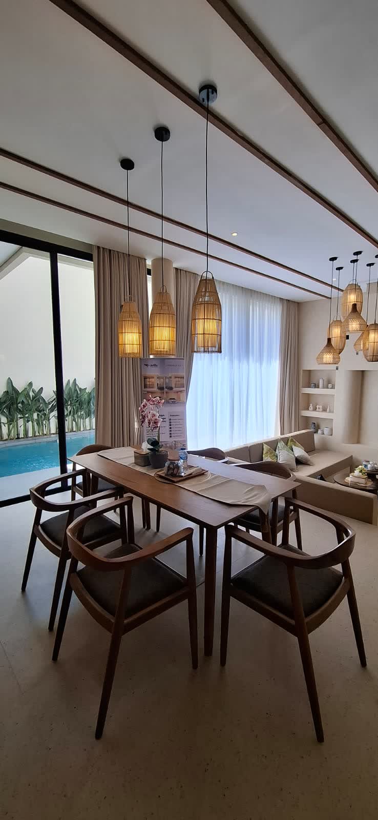 Jimbaran Hill show unit — dining area beside the pool